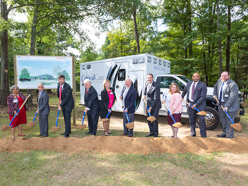 Taking part in the groundbreaking for the new Mississippi Center for Emergency Services building are, from left, Doris Whitaker, director of chaplain services; Dr. Alan Jones, professor and chair of the Department of Emergency Medicine; Dr. Damon Darsey, associate professor of emergency medicine and MCES medical director; former Gov. Haley Barbour; Dr. LouAnn Woodward, vice chancellor for health affairs; U.S. Sen. Roger Wicker; U.S. Rep. Gregg Harper; Aimee Meacham, chief of external affairs for BroadbandUSA; IHL Commissioner Dr. Al Rankins; and Dr. Jonathan Wilson, UMMC chief administrative officer.